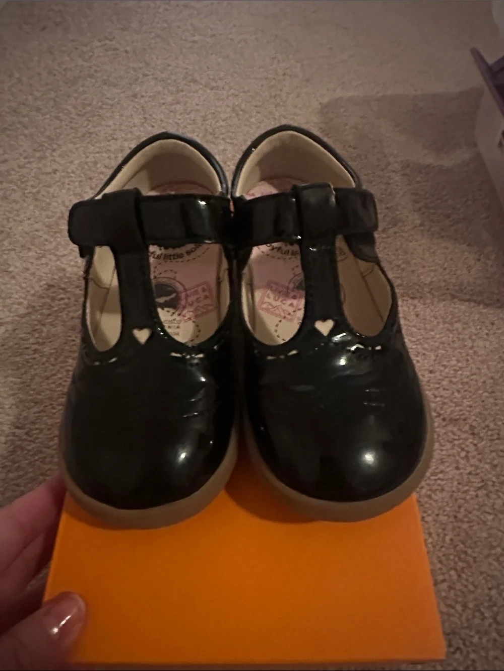 Livie & Luca Black Patent T-Strap Mary Janes with Heart Cutouts